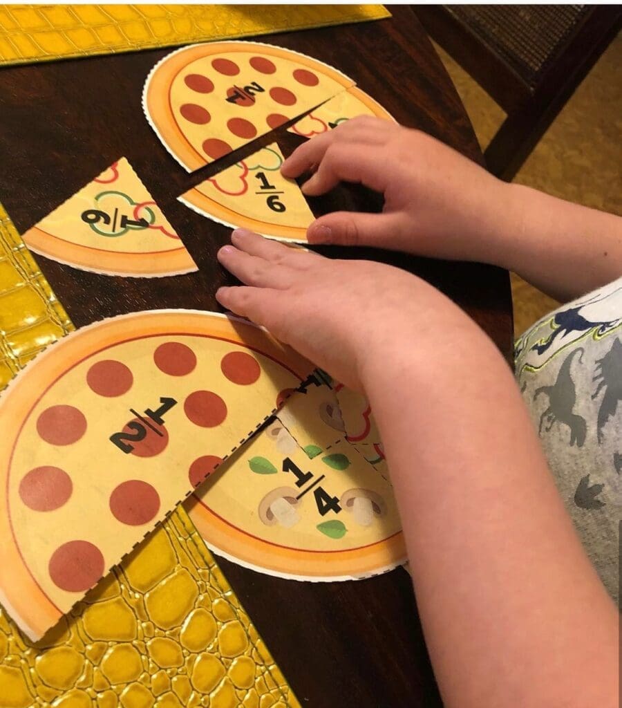 Child's hands are shown using fraction math manipulatives